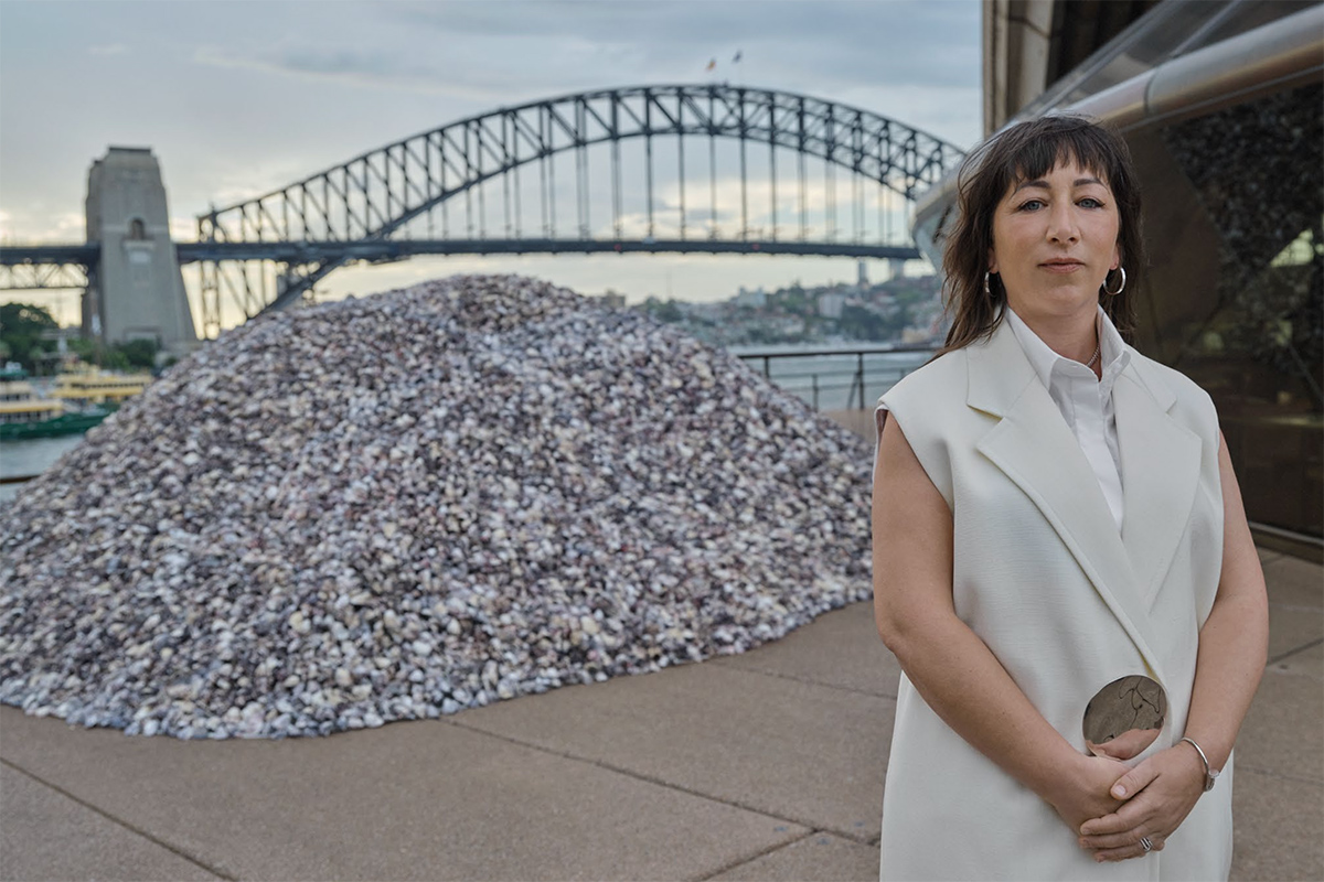 Megan Cope in front of her installation, Whispers, to mark the 50th anniversary of the Sydney Opera House.